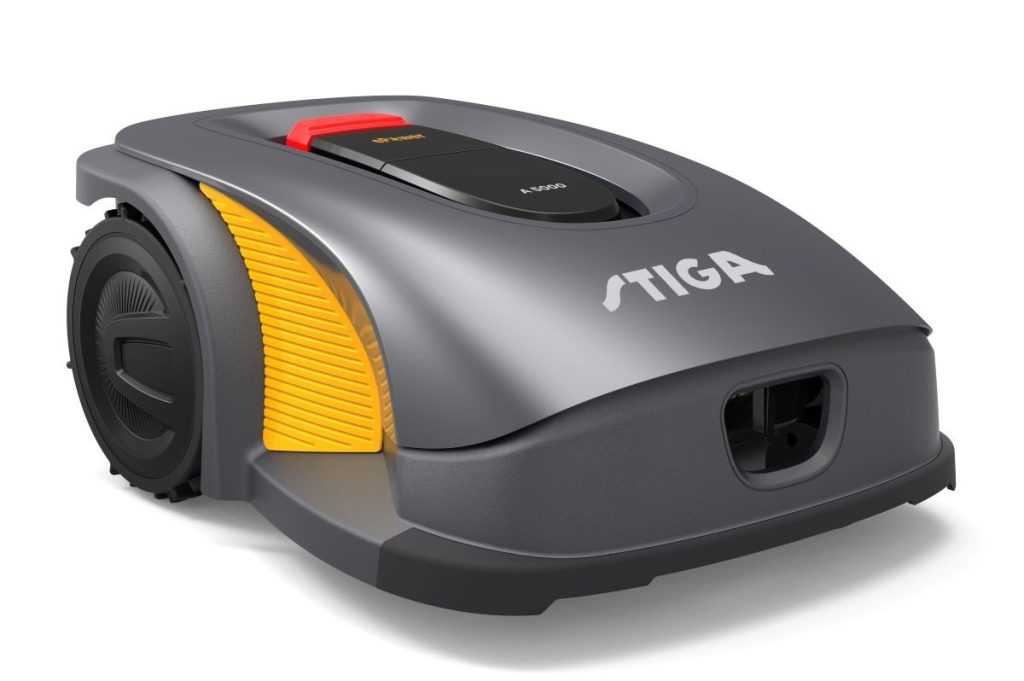 Stiga Rasenroboter dunkel: Detailansicht des Rasenroboters. Der Roboter ist anthrazit und hat einen roten Schalter. Orangefarbig abgesetzte Elemente am Gehäuse. 