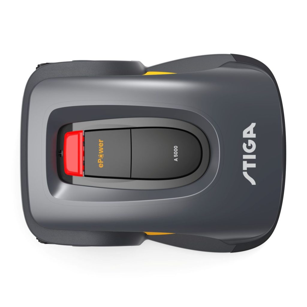 Stiga Rasenroboter dunkel von oben: Stiga Rasenroboter dunkel: Detailansicht des Rasenroboters. Der Roboter ist anthrazit und hat einen roten Schalter. Orangefarbig abgesetzte Elemente am Gehäuse. 