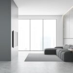 Renovieren – umfassender Ratgeber für Ihr Zuhause 1 Schicke Wohnung mit grauen Möbeln und grauen Wänden und Böden AdobeStock_301784853