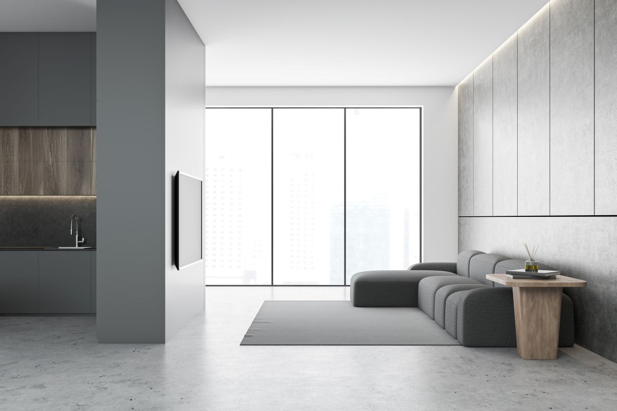 Renovieren – umfassender Ratgeber für Ihr Zuhause 16 Schicke Wohnung mit grauen Möbeln und grauen Wänden und Böden AdobeStock_301784853